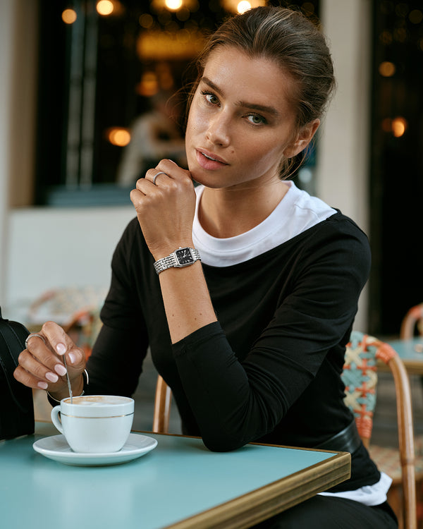 A square womens watch in Rhodium-plated 316L stainless steel from Waldor & Co. with black Diamond Cut Sapphire Crystal glass dial. Seiko movement. The model is Eternal 22 Bellagio.