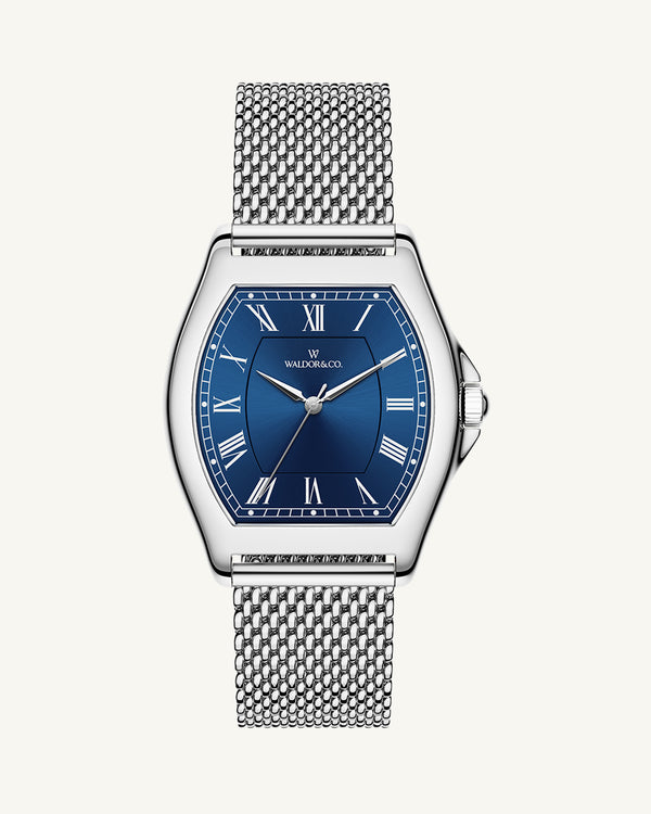 A tonneau mens watch in rhodium-plated silver from Waldor & Co. with blue sunray dial and a second hand. Seiko movement. The model is Constant 40 Lecco.