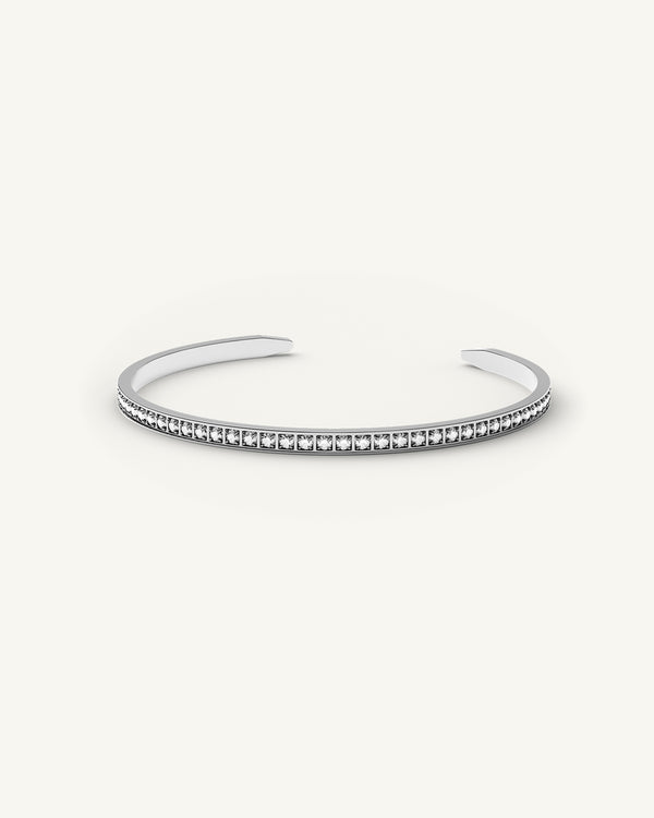 A polished stainless steel bangle in silver from Waldor & Co. One size. The model is Diamond Bangle Polished.