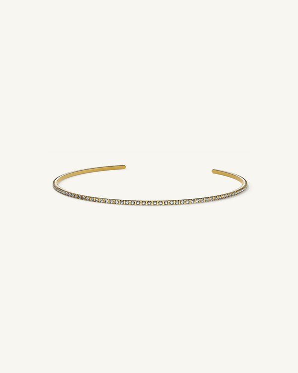 A Bangle in 14k gold-plated 316L stainless steel from Waldor & Co. One size. The model is Dulcet Bangle Polished.