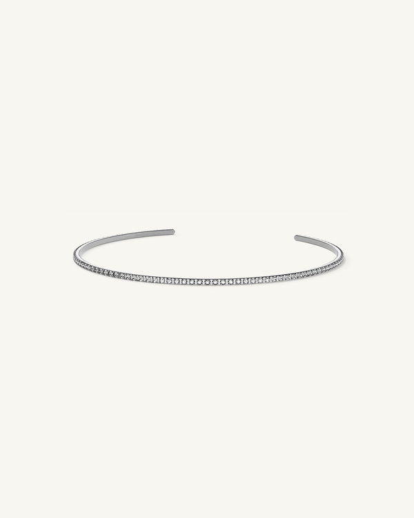 A Bangle in Rhodium-plated 316L stainless steel from Waldor & Co. One size. The model is Dulcet Bangle Polished.