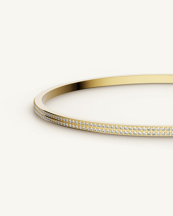 A Bangle in 14k gold plated 316L stainless steel from Waldor & Co. One size. The model is Pavé Bangle Polished.