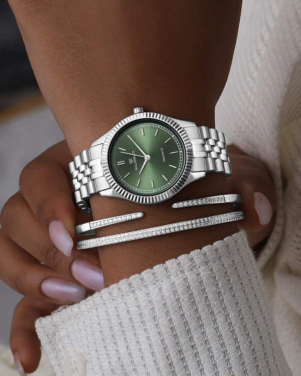  A round womens watch in silver from Waldor & Co. with green sunray dial and a second hand. Seiko movement. The model is Imperial 32 Positano 32mm.