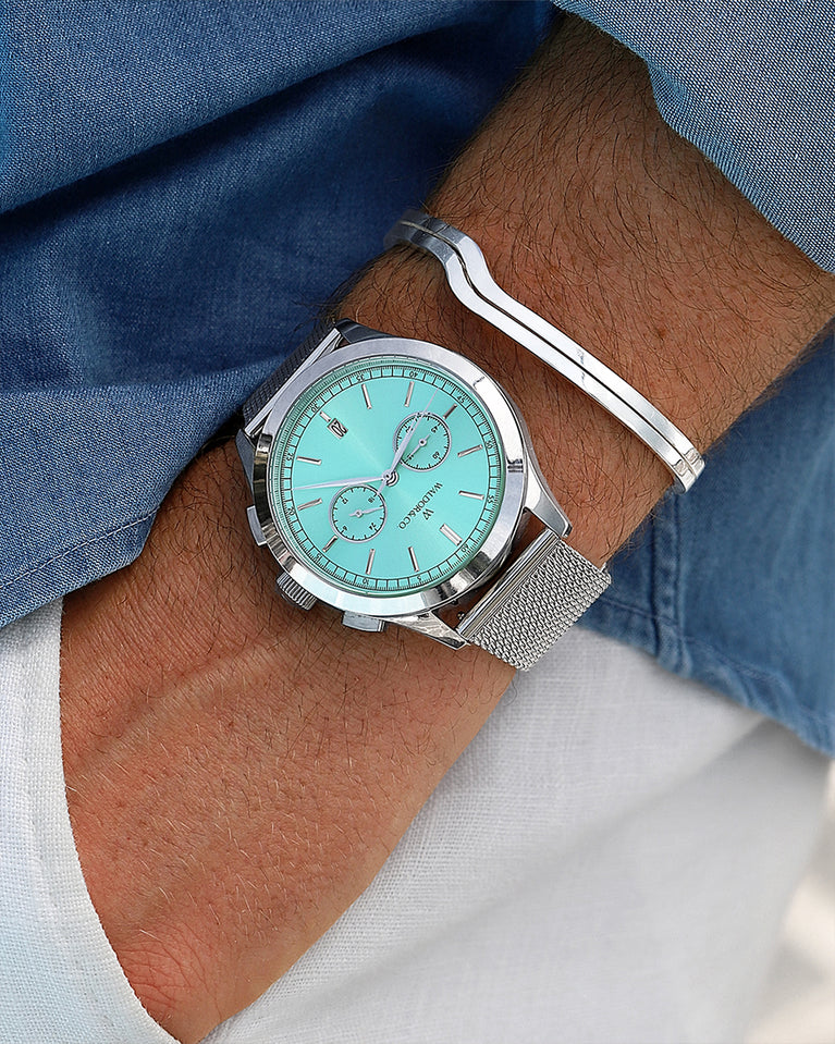  A round mens watch in rhodium-plated silver from Waldor & Co. with turquoise sunray dial and a second hand. Seiko movement. The model is Chrono 44 Sardinia 44mm.