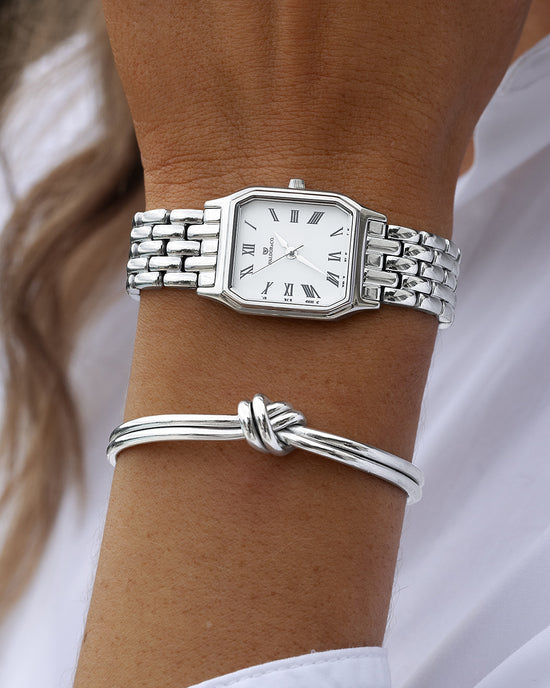lifestyle_image, A square womens watch in Rhodium-plated 316L stainless steel from Waldor & Co. with white Diamond Cut Sapphire Crystal glass dial. Seiko movement. The model is Eternal 22 Bellagio.