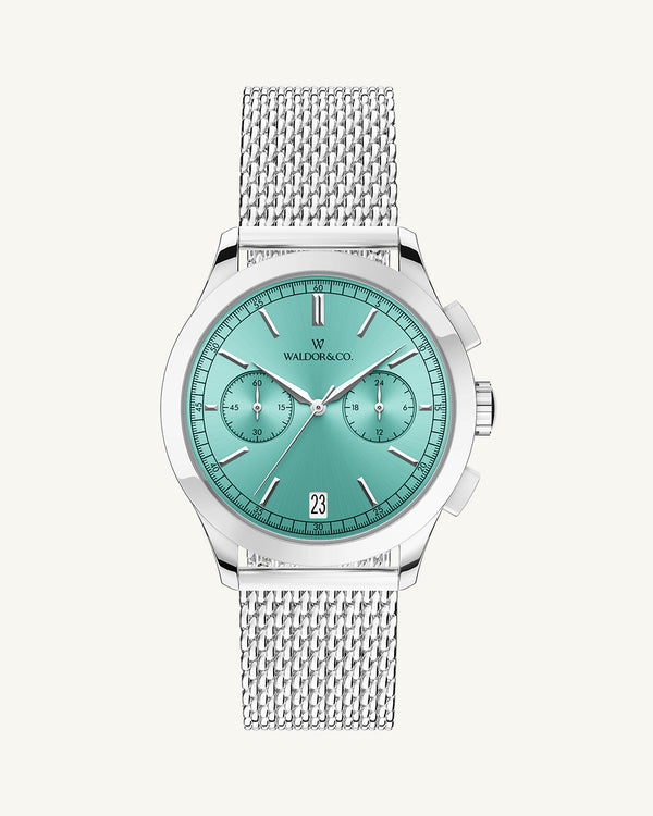 A round mens watch in rhodium-plated silver from Waldor & Co. with turquoise sunray dial and a second hand. Seiko movement. The model is Chrono 39 Sardinia 39mm.