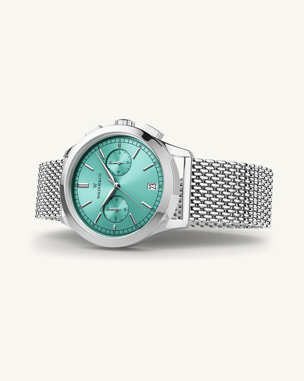 A round mens watch in rhodium-plated silver from Waldor & Co. with turquoise sunray dial and a second hand. Seiko movement. The model is Chrono 39 Sardinia 39mm.