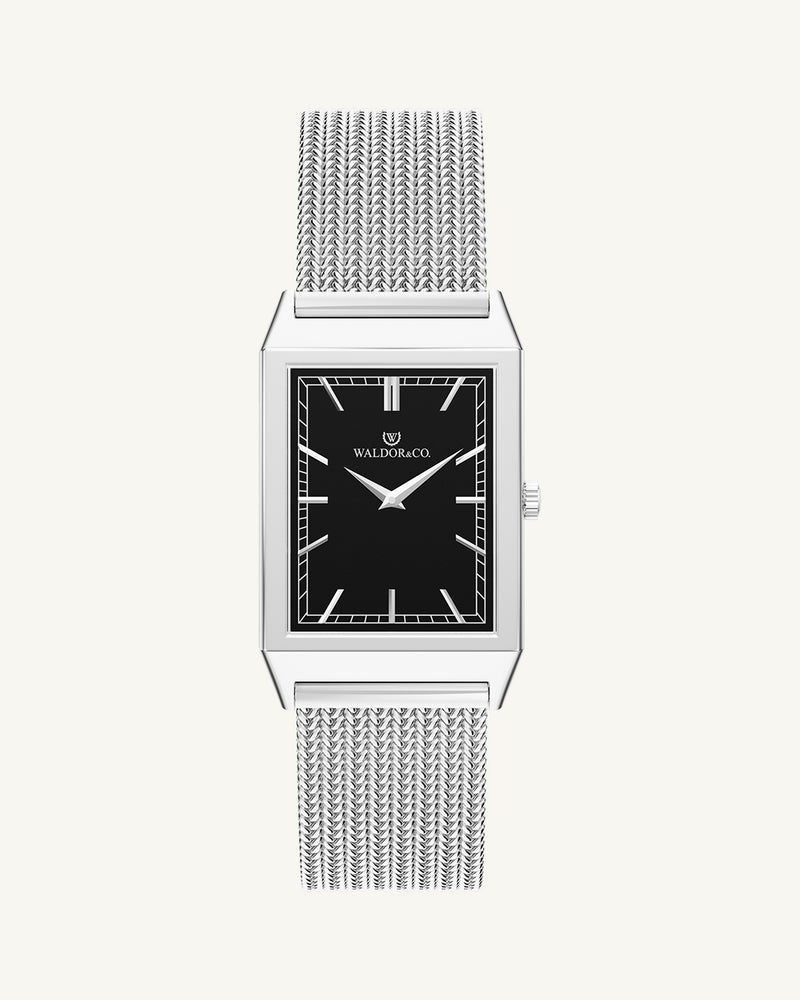 A square mens watch in rhodium-plated silver from Waldor & Co. with black sunray dial. Seiko movement. The model is Conceptual 37 Antibes 29x43mm.