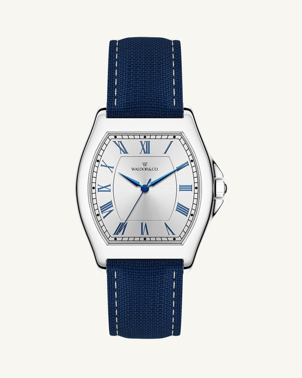 A square mens watch in Rhodium-plated 316L stainless steel from Waldor & Co. with white dial. Blue sailcloth strap. Ronda movement. The model is Constant 40 Tremezzo 37x45mm.