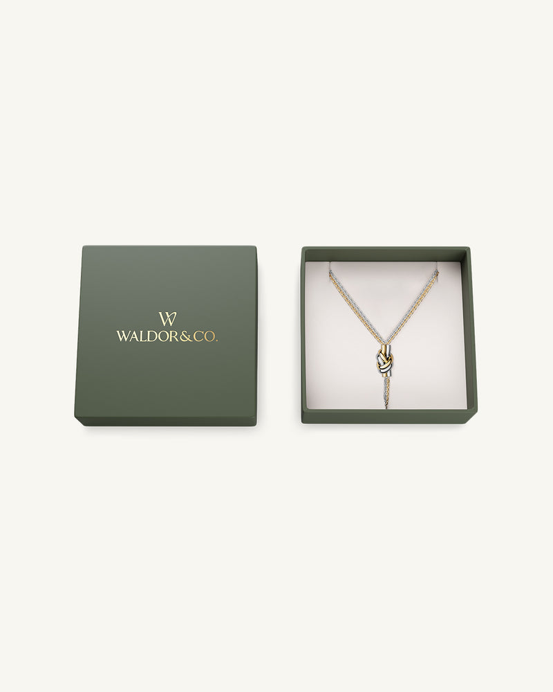 Necklace in silver and gold plated-316L stainless steel from Waldor & Co. The model is Dual Knot Necklace Polished.