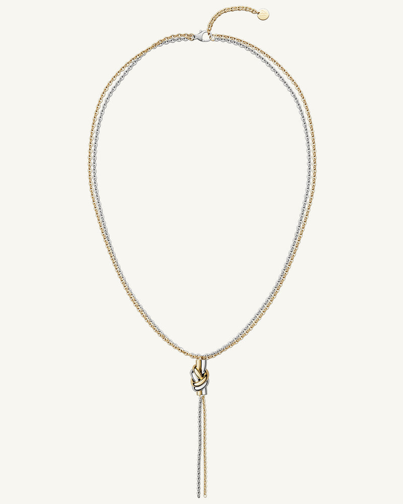 A polished stainless steel necklace in 14k gold from Waldor & Co. One size. The model is Dual Knot Ring.