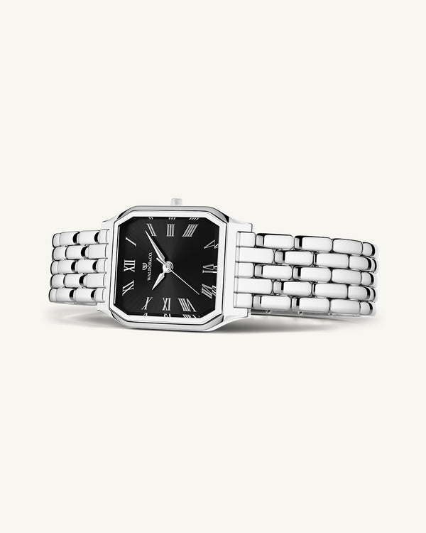 A square womens watch in Rhodium-plated 316L stainless steel from Waldor & Co. with black Diamond Cut Sapphire Crystal glass dial. Seiko movement. The model is Eternal 22 Bellagio.