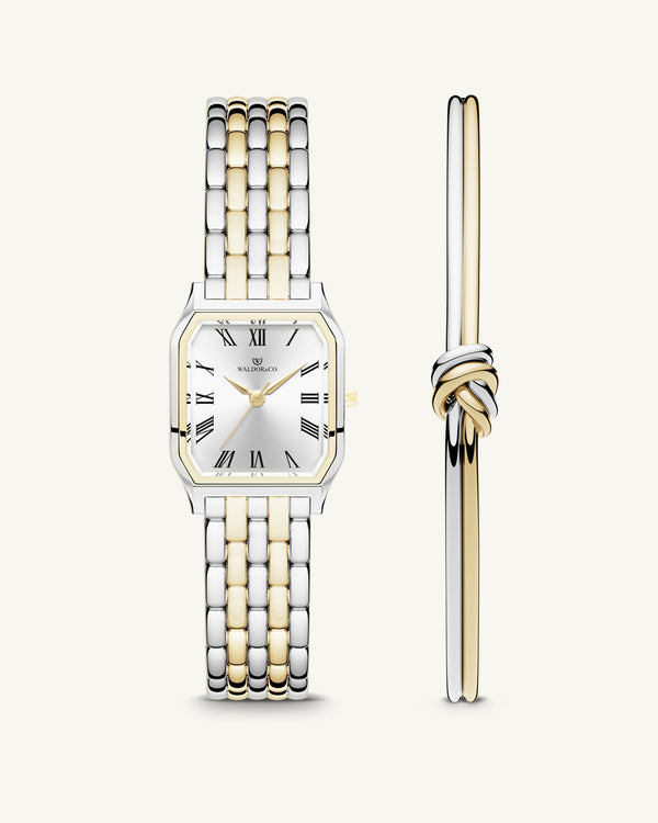 A square women’s watch and double knot bracelet in gold and silver from Waldor & co. The model is Eternal 22 Bellagio & Dual Knot Bangle.