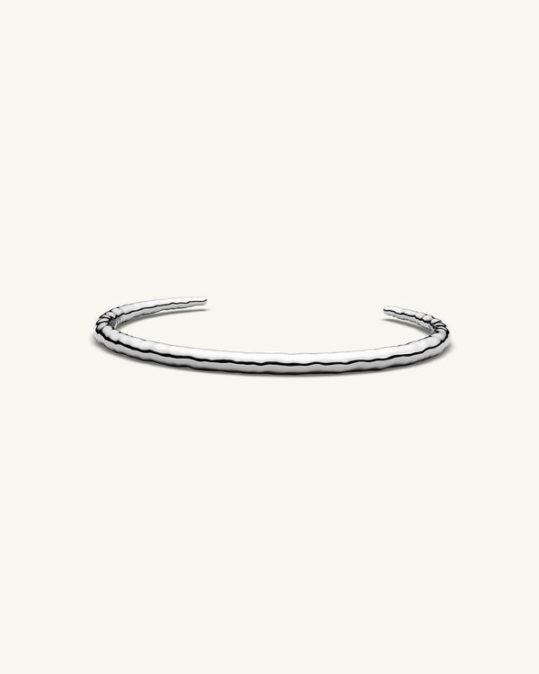 A Round Bangle in 925 Sterling Silver from Waldor & Co. The model is Opal Bangle Sterling Silver