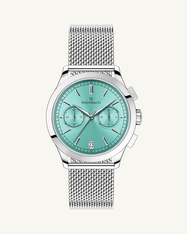 A round mens watch in rhodium-plated silver from Waldor & Co. with turquoise sunray dial and a second hand. Seiko movement. The model is Chrono 39 Sardinia 39mm.