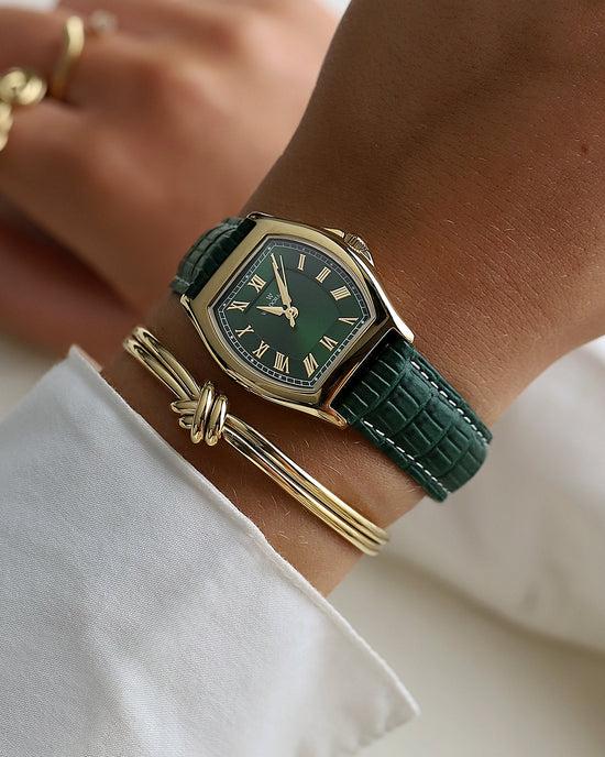 lifestyle_image, A square womens watch in 22k gold plated 316L stainless steel from Waldor & Co. with domed mineral glass dial. Seiko movement. The model is Constant 36 Laglio.