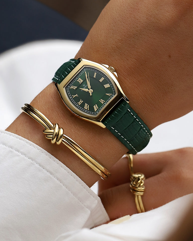  A square womens watch in 22k gold plated 316L stainless steel from Waldor & Co. with domed mineral glass dial. Seiko movement. The model is Constant 36 Laglio.