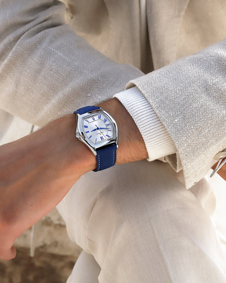  A square mens watch in Rhodium-plated 316L stainless steel from Waldor & Co. with white dial. Blue sailcloth strap. Ronda movement. The model is Constant 40 Tremezzo 37x45mm.