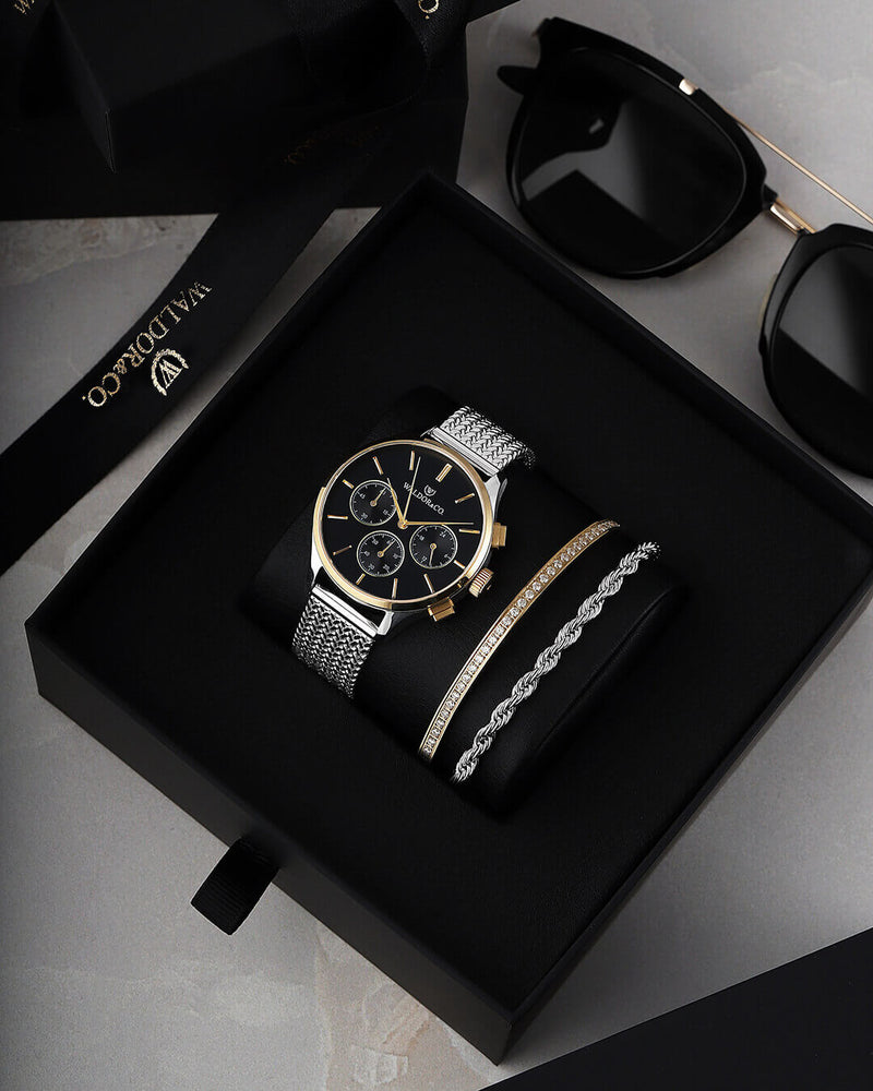 A round womens watch in14k gold-plated 316L stainless steel from Waldor & Co. with black dial  and a second hand. Seiko movement. The model is Epoch 36 Formentera 36mm.