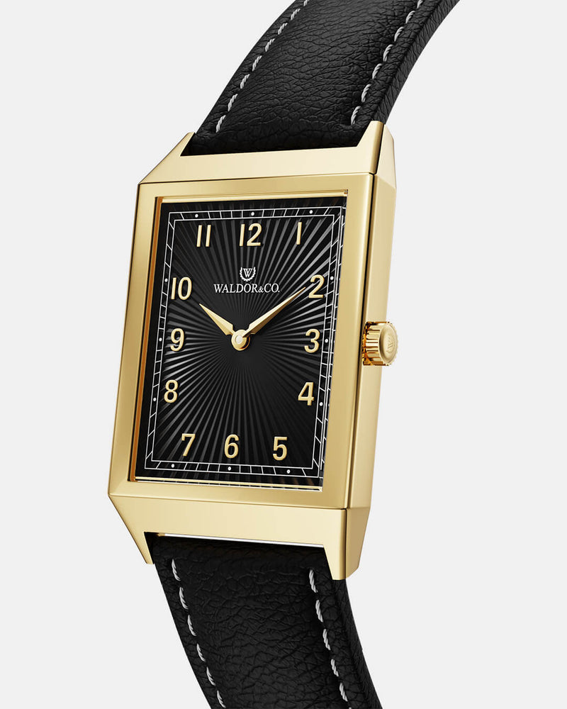 A square mens watch in 14k gold-plated 316L stainless steel from Waldor & Co. with black guilloche dial. Miyota movement. Leather strap. The model is Conceptual 37 Cap Ferrat.